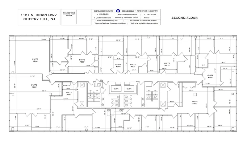 Full second-floor office building plan showing all suites, elevators and restrooms